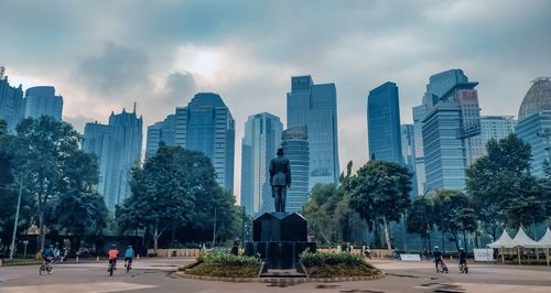 Panoramic view of modern buildings in city against sky