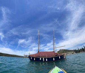 Ship in sea against blue sky