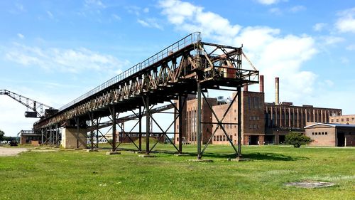 Low angle view of abandoned building against sky