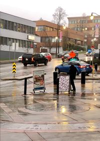 People on wet street in rainy season