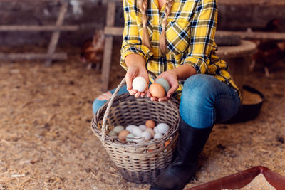 Midsection of man holding ice cream in basket