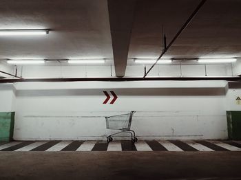 Cart under the sign to right