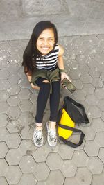 Full length portrait of smiling girl