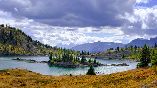 Scenic view of lake and mountains against sky