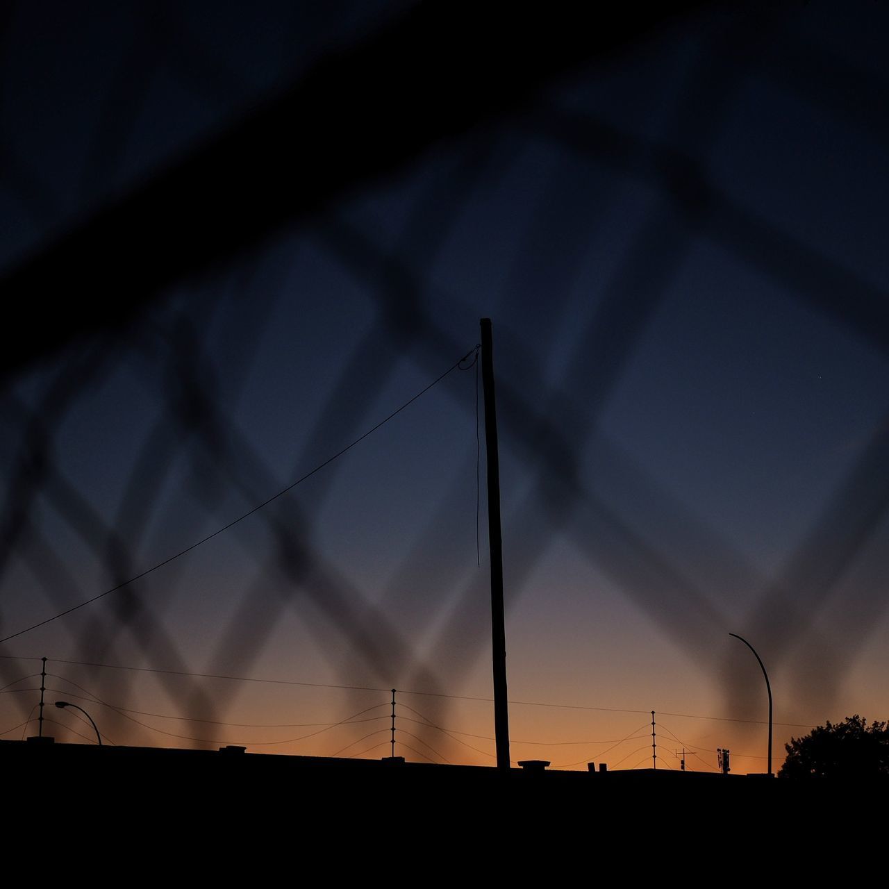 LOW ANGLE VIEW OF SILHOUETTE WIND TURBINE AGAINST SKY