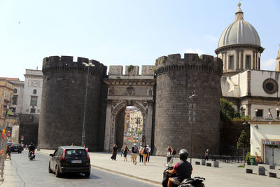 Group of people in front of historical building