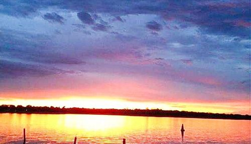 Reflection of clouds in lake during sunset