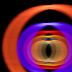Close-up of reflection on black background