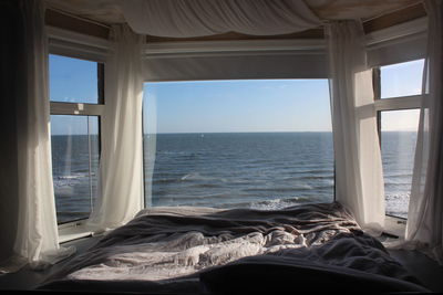 Scenic view of sea seen through window