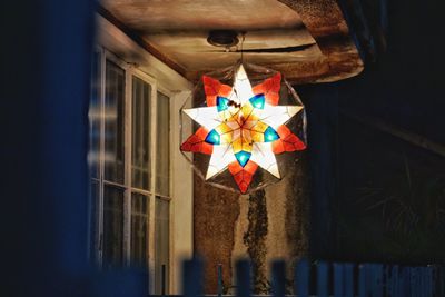 Directly above shot of christmas decorations hanging on paper