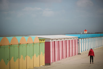 Rear view of man walking on beach