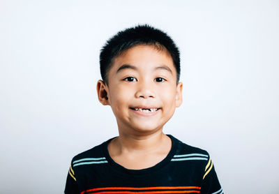 Portrait of young man against white background