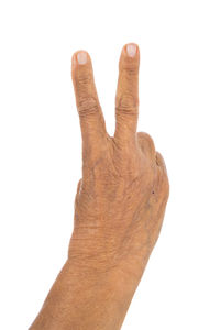 Close-up of human hand against white background