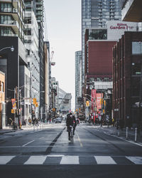 People on road in city