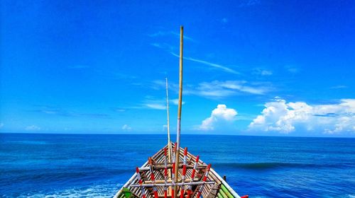 Boat in blue sea against sky