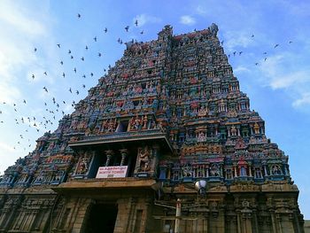 Low angle view of temple against sky in city