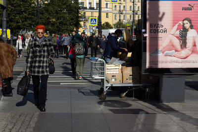 People walking on street in city