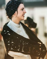 Smiling young woman during winter