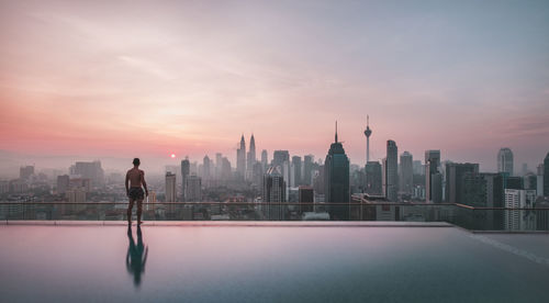 Man with cityscape in background