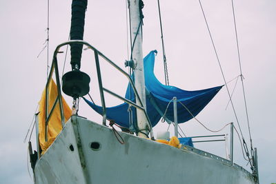 Low angle view of sailboat in sea against sky