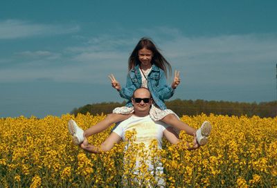 Portrait of dad with daughter on shoulders