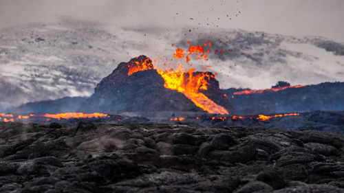 Scenic view of volcanic mountain during sunset