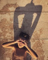 Shadow of woman standing on floor