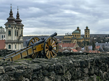 View of old building against cloudy sky