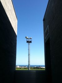 Low angle view of building against clear blue sky