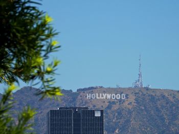 View of buildings against blue sky