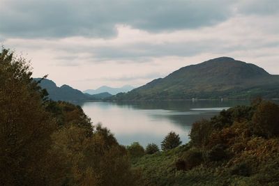 Scenic view of lake against cloudy sky