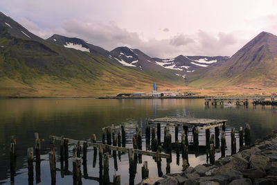 Scenic view of lake and mountains against sky