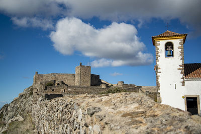 Low angle view of old ruins against sky