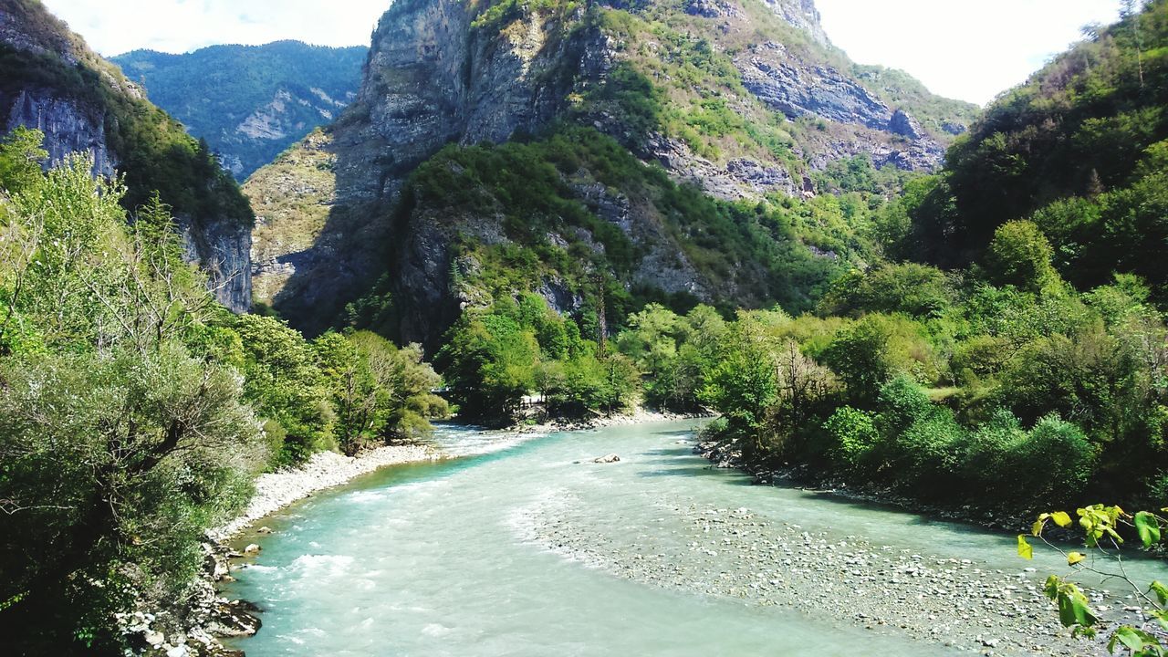 nature, water, scenics, beauty in nature, tree, day, tranquil scene, rock - object, mountain, river, tranquility, outdoors, no people, growth, plant, forest, landscape, waterfall, sky