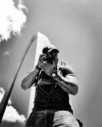 Low angle view of people against sky