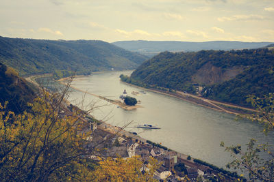 Scenic view of river and mountains against sky at kaub