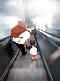 High angle view of people on escalator