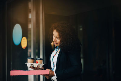 Young woman using mobile phone at night