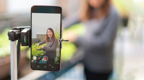 Close-up of woman using mobile phone