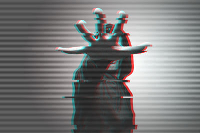 3d image of man gesturing against gray background
