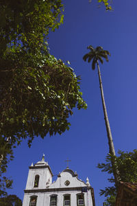 Low angle view of building against blue sky