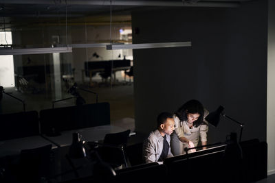 People working late in office