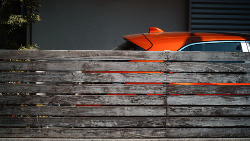 Close-up of red chair on table against wall