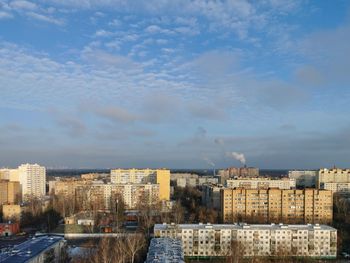 Buildings in city against sky