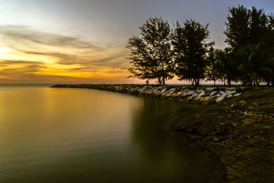 Scenic view of lake against sky during sunset