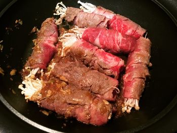 High angle view of meat in cooking pan