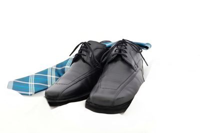 High angle view of shoes on floor against white background