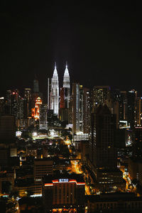 Illuminated buildings in city at night