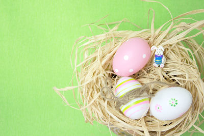 Directly above shot of easter eggs in animal nest on table