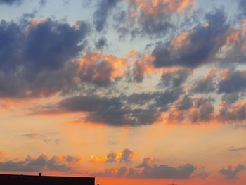 Low angle view of dramatic sky during sunset